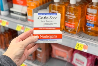 neutrogena on the spot acne treatment held in front of aisle