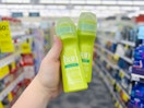 hand holding two ban roll-on deodorant