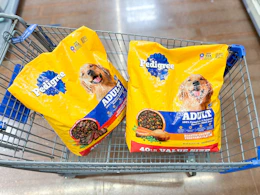 2 pedigree adult dog food bags sitting in a walmart cart