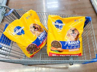 2 pedigree adult dog food bags sitting in a walmart cart