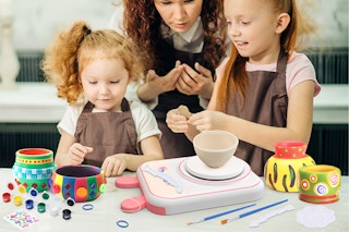 kids using a pottery wheel