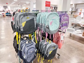 display of kids backpacks on racks