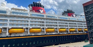 a Disney cruise ship docked in port