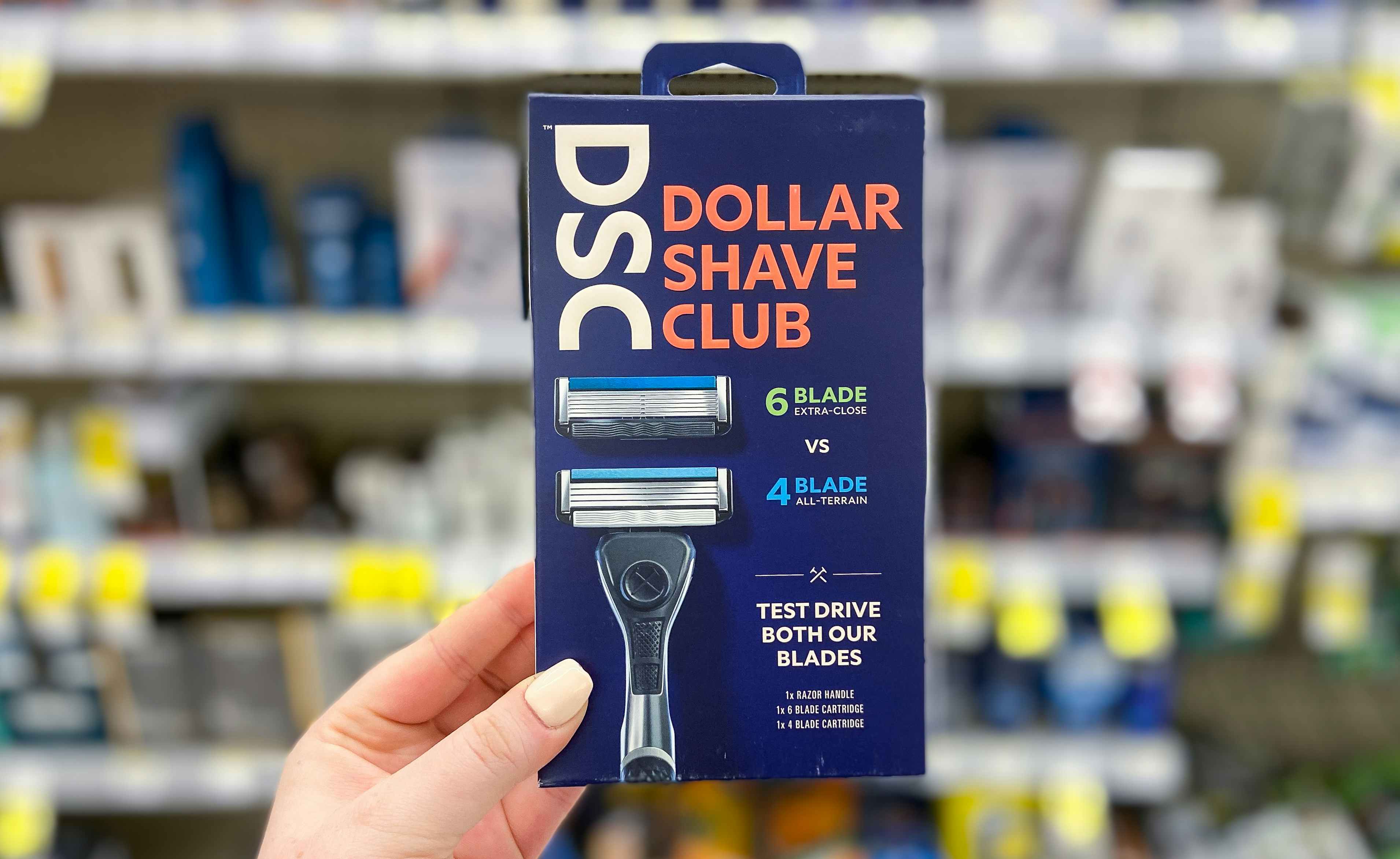 hand holding dollar shave club razor kit