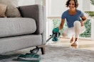 a woman using a vacuum