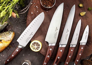 Japanese chef knives on a wooden cutting board