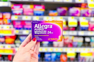 hand holding up a box of allegra