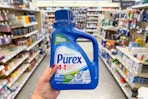 hand holding purex detergent in walgreens