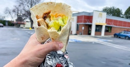 Wendy's grilled chicken ranch wrap with McDonald's in the background