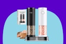 An electric salt grinder in white and pepper grinder in black. Both are clear half the way up. Some food and a box sit or float behind them