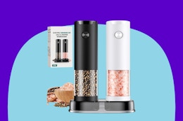 An electric salt grinder in white and pepper grinder in black. Both are clear half the way up. Some food and a box sit or float behind them