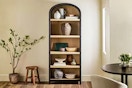 Lifestyle image of the Walker Edison Arched Bookcase in home setting
