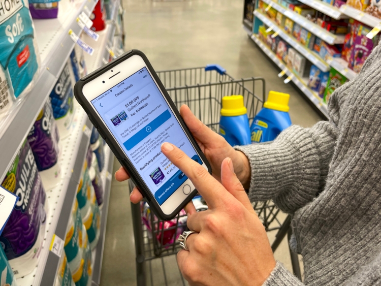Person adding digital Walgreens coupons on app