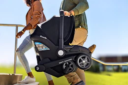 Lifestyle image of the Evenflo Shyft DualRide Combo if the stroller being carried up a staircase