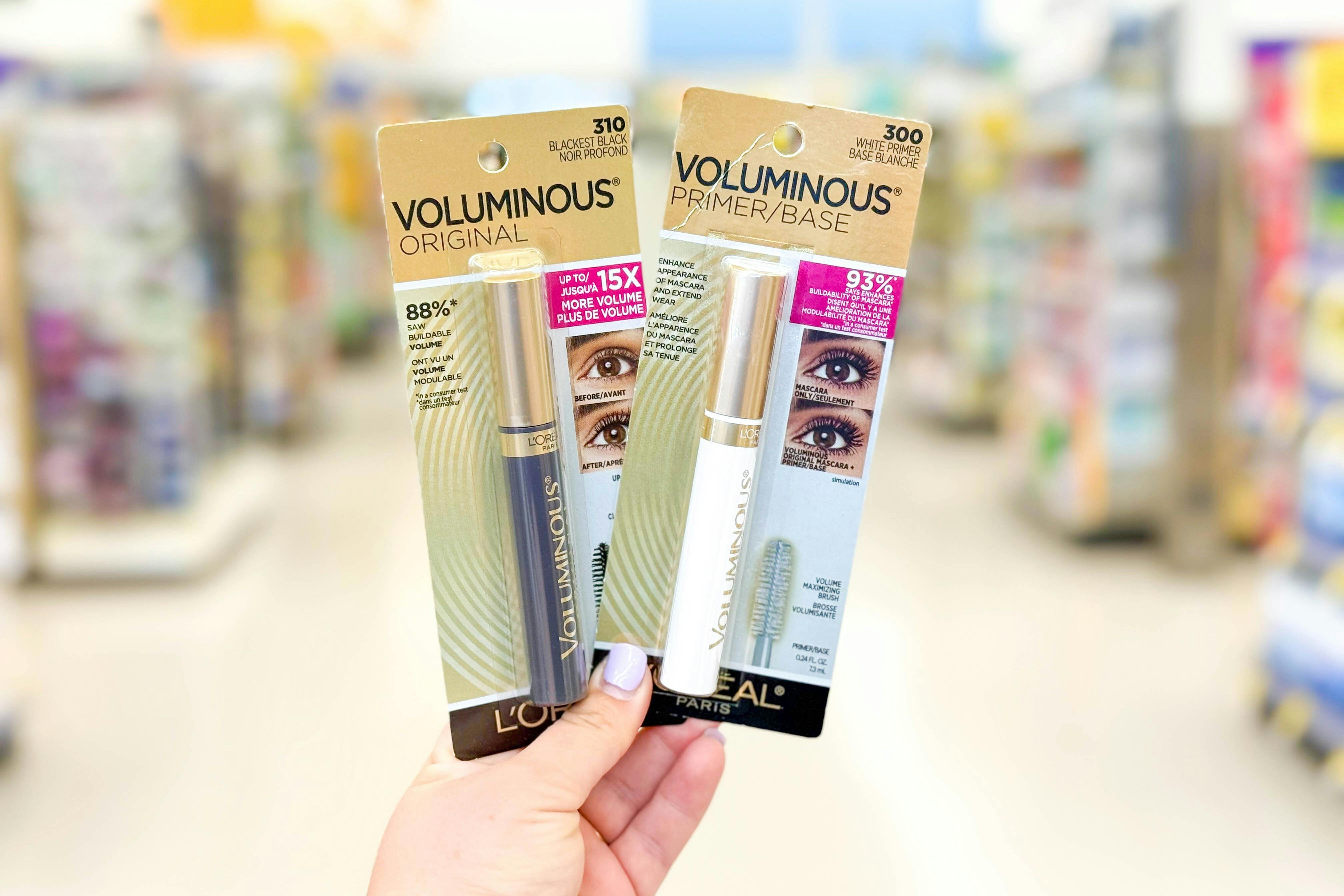 hand holding two l'oreal mascaras