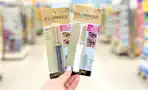 hand holding two l'oreal mascaras