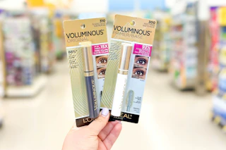 hand holding two l'oreal mascaras