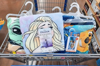 character towels in a Walmart cart: Frozen, Paw Patrol, Baby Yoda