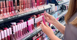 person testing nyx professional makeup liquid lipstick in ulta store