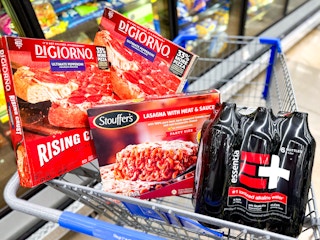 two digiorno pizzas stouffers lasagna and essentia in walmart cart
