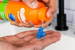 shaving gel being sprayed into hand
