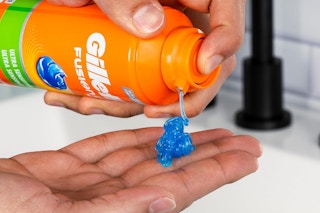 shaving gel being sprayed into hand