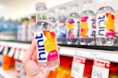 hand holding a bottle of hint flavored water at target
