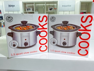 two small slow cookers side by side on a display in jcpenney