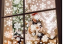 116PCS Christmas Decorations, 9 Sheets Christmas Window Clings on a window.