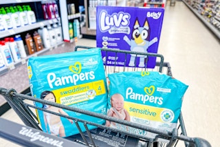pampers and luvs diapers in a walgreens shopping cart