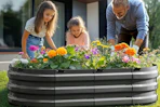 family planting flowers together in garden bed
