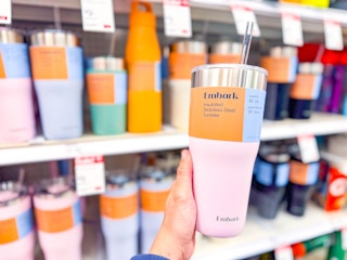 hand holding an embark tumbler at target