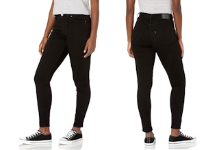 A woman wearing Levi's black skinny jeans.