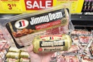 hand holding jimmy dean bacon and sausage