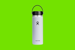 a hydro flask bottle on a green background