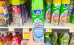 hand holding up scrubbing bubbles bathroom cleaner
