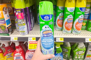hand holding up scrubbing bubbles bathroom cleaner