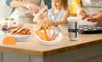 a family making bread with a sourdough kit in a kitchen