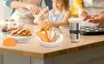 a family making bread with a sourdough kit in a kitchen