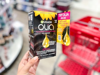 Garnier Olia Hair Color product in hand at Target. Messaging on box says "Try Olia on us! Scan for rebate."