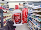 hand holding colgate oral care items in walgreens