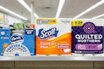 toilet paper packs on a store shelf