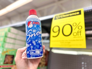 hand holding snow can in walmart aisle