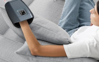 a person using a hand massager 