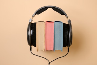 A set of books with headphones on