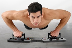 a man using a push up board