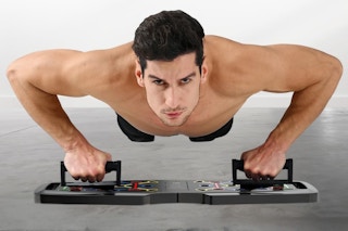 a man using a push up board
