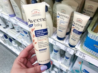 hand holding aveeno baby soothing ointment at target