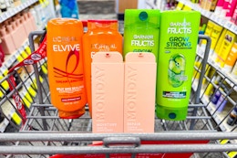 loreal elvive, garnier fructis, and monday hair care products in a cart