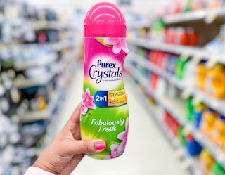 hand holding a bottle of Purex Crystals